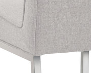Chaise de salle à manger en tissu aux lignes épurées - base en acier poli